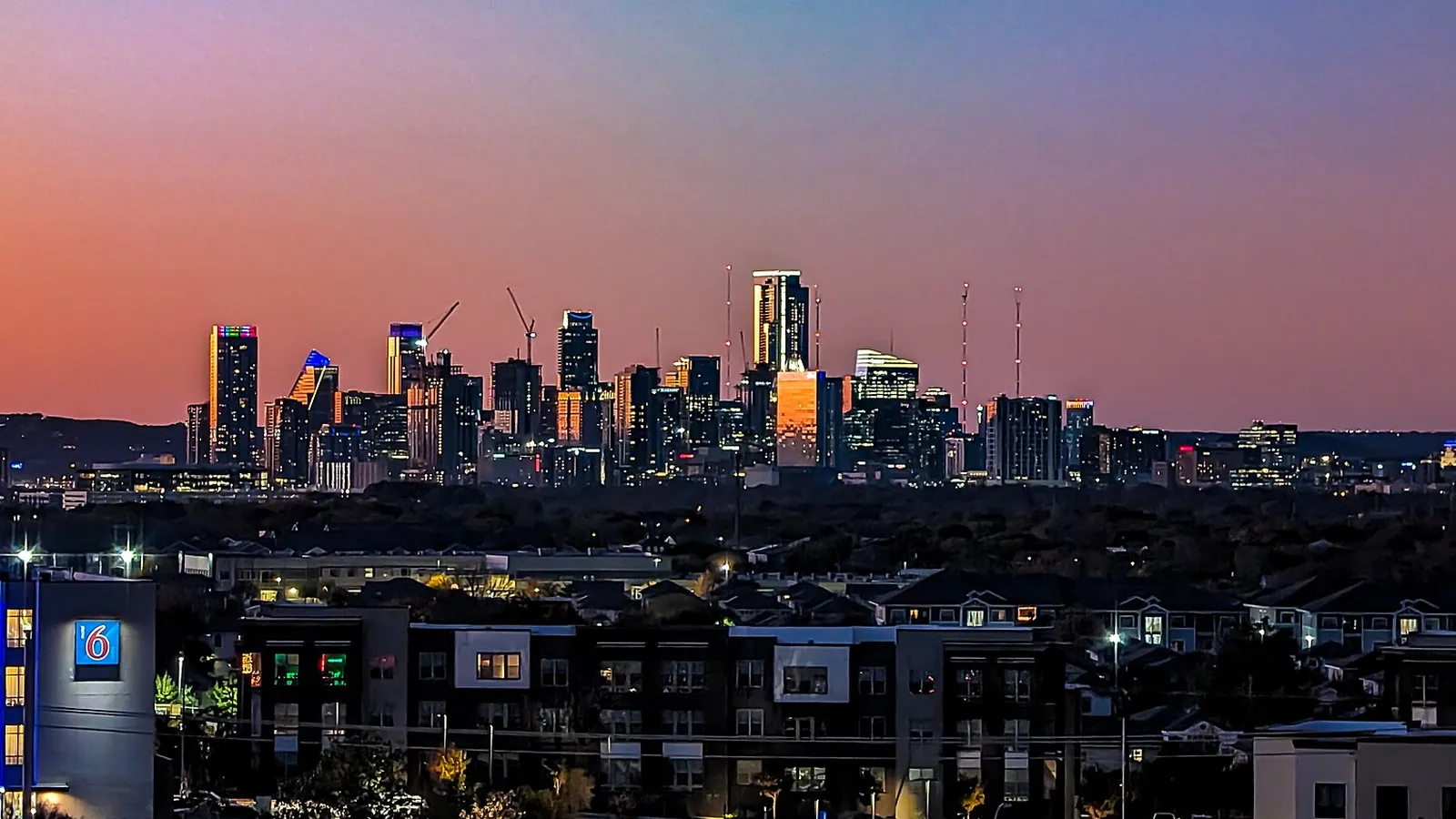 Austin skyline at dusk seen across the city